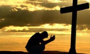 Praying before Cross